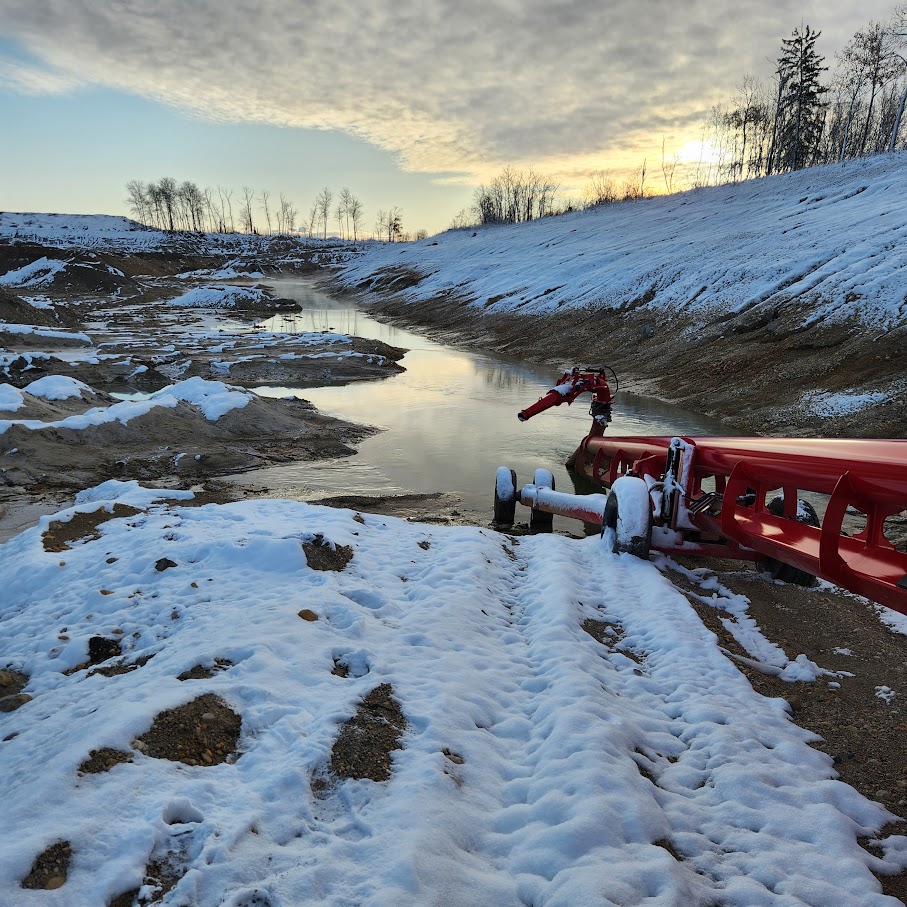 Construction site at first snowfall, winter sunset